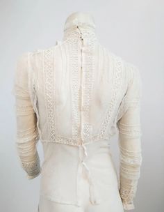 1900s White Lace Sheer Mesh Blouse For Sale at 1stDibs Elegant Cotton Lace Top, Elegant Victorian Dress With Lace Trim For Vintage Events, Elegant Cotton Lace Top With Lace Collar, Elegant Cotton Lace Top With Lace Trim, Elegant Cotton Lace Top With Lace Work, Fitted Lace Victorian Dress For Vintage Events, Fitted Lace Top With Lace Sleeves For Daywear, Elegant Cotton Lace Daywear Top, Elegant Fitted Victorian Dress With Lace Patchwork