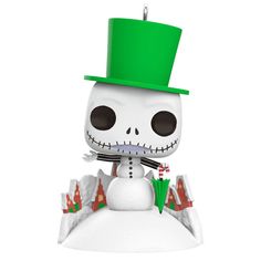 the skeleton is wearing a green hat and standing on top of a snow covered hill