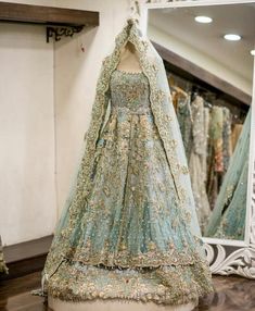 a dress on display in front of a mirror