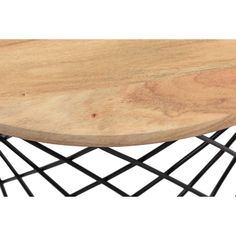 a wooden table with black metal legs and a wood top on an iron frame base