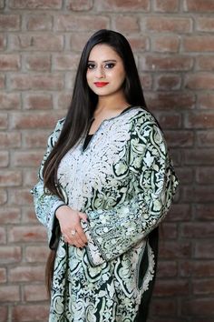 A stunningly marvellous Pheran. This Pheran features intricate Kashmir Aari embroidery on all-over the front side and on the sleeves.- - - - - - - - - - - - - - - - - - - - Product Details- Condition: Brand New (made to order)- Style: Phiran Tunic- Fabric: Pure Wool- Colour: Dark Green- Embroidery: Jaal Aari Work- Embroidery Colour: Multi-Colour- Standard Length: 40" | Can be customized- Care Instructions: Dry Clean Only**If you want the Tunic to be shorter or longer, just send us a message, and Elegant Multicolor Embroidered Fabric, Traditional Green Kaftan With Intricate Embroidery, Elegant Multicolor Chikankari Embroidered Fabric, Elegant Multicolor Traditional Wear With Chikankari Embroidery, Elegant Green Embroidered Fabric For Eid, Ceremonial Chikankari Embroidered Kurta, Elegant Green Fabric With Chikankari Embroidery, Green Ceremonial Dupatta, Kurtis Indian