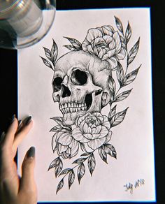 a drawing of a skull with roses on it