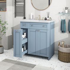 a bathroom with a sink, mirror and towel rack on the wall next to it