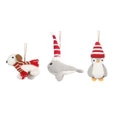 three knitted animals hanging from strings on white background, each with a red and white striped hat