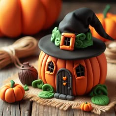 a pumpkin with a witch's hat sitting on top of it