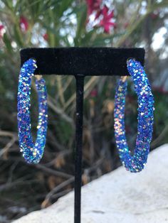 Royal blue glitter hoops earrings Length 2.5 inches Blue Hoop Earrings For Party, Party Hoop Earrings With Bling, Party Small Hoop Bling Earrings, Sparkling Blue Round Jewelry, Small Hoop Crystal Earrings For Party, Small Hoop Earrings For Party, Blue Glitter Jewelry For Party, Hoop Earrings For Party, Blue Hoop Earrings