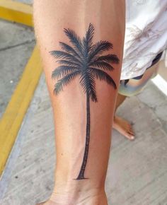 a small palm tree tattoo on the foot