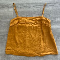 Brand New Gold Fitted Tops For Vacation, Fitted Gold Top For Vacation, Mustard Relaxed Fit Top For Spring, Casual Gold Sleeveless Top, Gold Sleeveless Casual Top, Orange Linen Top For Summer, Spring Orange Linen Top, Mustard Relaxed Fit Tops For Summer, Casual Mustard Sleeveless Top