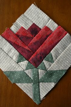 a piece of fabric sitting on top of a wooden table