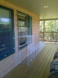 there is a dog kennel on the front porch