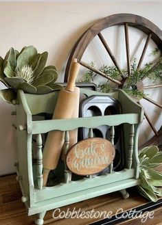 an old wheel is used as a planter for succulents and herbs