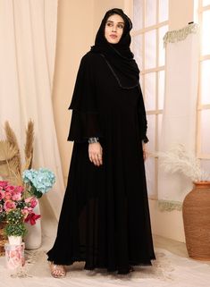 Introducing our elegant black abaya and hijab set, designed for the modern woman seeking modest yet stylish attire. Made from high-quality georgette fabric, this ensemble offers a comfortable and breathable fit. The black color pakistani set exudes sophistication, while the intricate lace work detailing adds a touch of femininity. With full sleeves, this outfit provides modest coverage without compromising on style. Perfect for any occasion, our black abaya and hijab set is a must-have addition to your wardrobe. Georgette Abaya For Eid, Long Black Abaya For Eid, Modest Black Khimar, Black Long Khimar For Eid, Black Long Sleeve Hijab For Eid, Black Long Abaya, Long Sleeve Black Khimar For Eid, Black Long Sleeve Khimar For Eid, Black Maxi Abaya For Eid