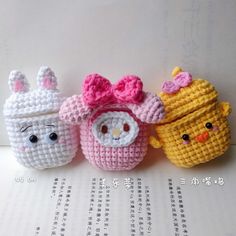 three small crocheted toy animals sitting next to each other