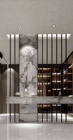 an elegant bathroom with marble counter tops and black bars on the walls, along with built - in shelving