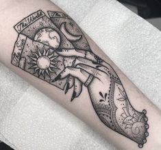 a woman's arm with a tattoo on it