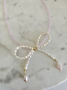 For all the bow lovers🎀 Length: 16 inches + 2 inch extender Material: 24k gold plated on brass An original Nikki Jewels design🤍 Elegant White Jewelry With Pink Bow, Elegant Adjustable Jewelry With Pink Bow, Pink Bow Jewelry Gift, Adjustable Necklace With Decorative Bow For Gifts, Adjustable Necklace With Decorative Bow As Gift, Adjustable Gold Jewelry With Decorative Bow, Elegant Pink Bow Jewelry Gift, Elegant Pink Bow Jewelry For Gift, Feminine Jewelry With Pink Bow As Gift