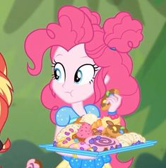 the pinkie is holding a tray full of donuts