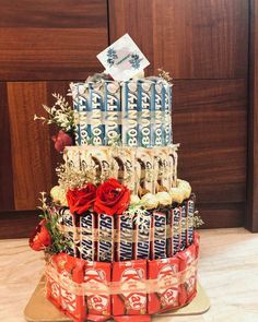 a tiered cake made out of cans and candy