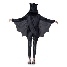 a woman wearing a black bat costume