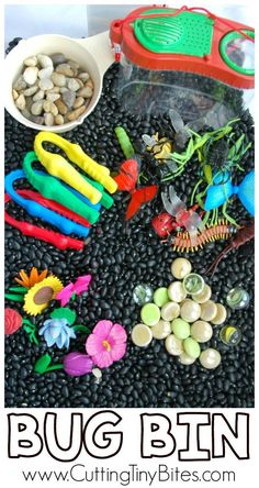 a pile of plastic toys sitting on top of black beans