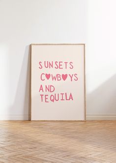 a pink poster with the words sunsets, cowboys and tequila on it in front of a white wall