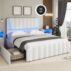 a white bed sitting in a bedroom next to a window with blue lights on it