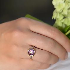 This beautiful stackable bezel set ring features gorgeous faceted natural Purple Amethyst set in 18K Vermeil Gold. There is a row of sparkling faceted white topaz gemstones pave set on the band near the Purple Amethyst Stone. The setting is in sterling silver with gold plating/black rhodium plating.  The ring has a 925 stamp.  Gemstone size is 10 mm.  Also available in sterling silver or rose gold. Please specify your ring size at the checkout. Since I use natural gemstones, the stones may vary slightly in color and shape. Ring will be shipped in Danique Jewelry branded box. Please contact me for any additional info. Thanks! Please visit my full collection of RINGS: http://www.etsy.com/shop/DaniqueJewelry/search?search_query=ring Please visit my full collection of AMETHYST: http://www.etsy Amethyst Diamond Ring With Gemstone Accents As Gift, Adjustable Rings With Gemstone Accents In Fine Jewelry Style, Adjustable Fine Jewelry Rings With Gemstone Accents, Adjustable Amethyst Ring With Gemstone Accents, Fine Jewelry Amethyst Faceted Ring, Fine Jewelry Amethyst Rings With Faceted Details, Faceted Amethyst Ring In Fine Jewelry Style, Fine Jewelry Faceted Amethyst Ring, Fine Jewelry Amethyst Ring With Gemstone Accents For Gift