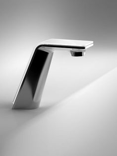 a black and white photo of a sink faucet in the shape of a rectangle