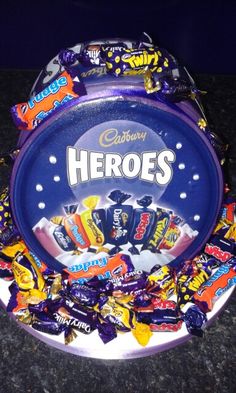 a bowl filled with candy sitting on top of a counter