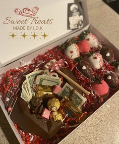 a box filled with assorted chocolates and candies on top of a counter