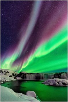 an aurora bore is seen above the water