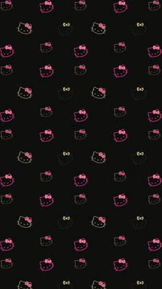 a black background with pink and yellow hello kitty glasses on it's face,