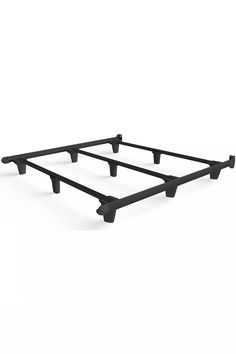 a black metal bed frame with four legs