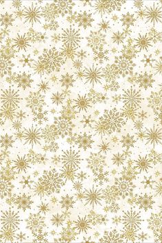 a white and gold wallpaper with snowflakes on it