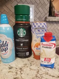 the ingredients to make an iced coffee smoothie are sitting on the counter top next to each other