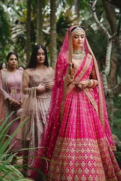 The renaissance of Pink lehengas is a luxe trend that every bride will instantly fall in love with. Take inspiration from these gorgeous brides! :heart: #weddingoutfits #weddinglehenga #weddingfashion #bridaloutfits Magenta Wedding Lehenga, Hot Pink Lengha Bridal, Lahga Design Bridal Lehenga, Bridal Lehenga Unique Colour, Wedding Ghagra Brides, Magenta Lehenga Bridal, Pink Bridal Lehenga Brides, Bride Lehenga Indian Pink, Hot Pink Bridal Lehenga Wedding