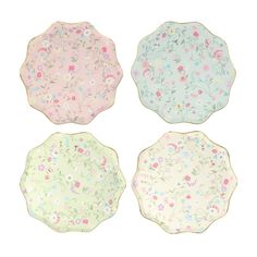 four plates with floral designs on them, one is pink and the other is blue