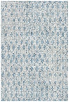 an area rug with blue and white designs on it