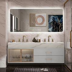 a bathroom with marble counter tops and gold accents