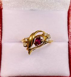 Beautiful Vintage 14k Gold Natural Pear Shaped Ruby and  Diamonds Ring 100%  Natural Ruby and Diamonds Beautiful genuine Ruby Ruby:                                            0.50 CT Diamond(s)                                 0.12 CT Color:                                                    G Clarity:                                                SI2 Total ring weight:                        2.6 GR 14K Yellow Gold Ring sizing available Free of Charge For more information regarding this item fee Pear-shaped Brilliant Cut Yellow Gold Ruby Ring, Elegant Pear-shaped Ruby Ring With Diamonds, 14k Yellow Gold Pear-shaped Birthstone Ring, Pear-shaped 14k Yellow Gold Birthstone Ring, Elegant Pear-shaped Yellow Gold Birthstone Ring, Elegant Yellow Gold Pear-shaped Birthstone Ring, Pear-shaped Yellow Gold Birthstone Ring, Elegant Pear-shaped Yellow Gold Ruby Ring, Exquisite Pear-shaped Yellow Gold Ring