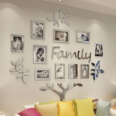 a living room filled with furniture and pictures on the wall above it's coffee table