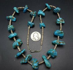 "VINTAGE NAVAJO TURQUOISE NECKLACE DESCRIPTION: This strand features hand formed beads of blue Kingman turquoise, spaced and finished with fine hand rolled shell heishi. PLEASE NOTE: One of the turquoise beads is chipped, it is at the end of the strand (see photos). This gorgeous necklace will be a valuable addition to your collection of fine vintage Native American jewelry. MEASUREMENTS: Necklace measures 25\" end to end Beads are securely strung on natural fiber WEIGHT: 104.9 grams SIGNED: no Spiritual Blue Turquoise Necklace With Spacer Beads, Vintage Turquoise Gemstone Beads Jewelry, Artisan Single Strand Turquoise Necklace For Jewelry Making, Artisan Turquoise Necklace For Jewelry Making, Handmade Blue Turquoise Necklace Collectible, Handmade Blue Turquoise Necklace For Collectors, Handmade Blue Turquoise Collectible Necklace, Vintage Turquoise Single Strand Necklace, Vintage Turquoise Necklace With Polished Beads