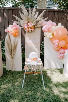 an outdoor party with balloons and decorations