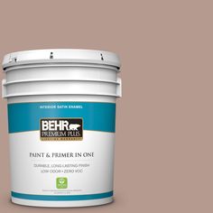 the behr paint and primer in one is shown on a gray background with red trim