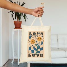 This 100% cotton bag comes in one size - 15" x 16"- perfect for everyday wear. While the canvas material will show off your designs in great colors, it's durable and will last for years. The bag features 20" handles (made from the same canvas), making it easy to carry even with a week's worth of shopping. .: 100% cotton canvas .: Heavy fabric (12 oz/yd² (406.9 g/m .: Sewn-in label .: Available in natural and black colors Canvas Making, Love Canvas, Canvas Tote Bag, Cotton Bag, Sew-in Labels, Canvas Material, Heavy Fabric, Canvas Tote, Cotton Canvas