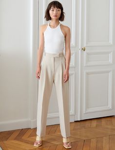 Bestseller -PREORDER Estimated arrival January 7 Chic sand colored high waist pleated trousers . Brand Pixie Market 80% polyester , 16% rayon , 4% elastaneDry clean only Side pockets Faux back vent pockets High waist Size xs waist 24.5" , hips 34.5"Size small waist 26.5", hip 36.5"Size medium waist 28.5", hip 38.5"Size large waist 30.5", hip 40.5"Inseam 27" Total length 39"Model is wearing an xs and model's height is 5.8"Vintage style Chic Beige Dress Pants With Belt Loops, Fitted Beige Tapered Leg Pants, Tailored Beige Bottoms With Belt Loops, Chic Neutral Bottoms For Business Casual, Beige Tapered Leg Business Casual Bottoms, Chic Neutral Bottoms For Work, Fitted Beige Wide Leg Pants With Belt Loops, Beige Fitted Tapered Leg Bottoms, Beige High Waist Dress Pants For Business Casual