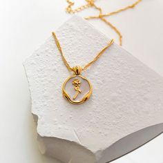 The Little Prince's Rose Necklace features a hand-crafted rose pendant dipped in 18-carat gold and a shining chain with a well-polished texture. Flower Gold Necklace, Small Gold Necklace, 18k Gold Necklace, Wear Store, Rose Pendant, Jewelry Picture, Rose Necklace, Necklace Rose, Flower Pendant Necklace