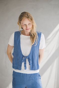 "DETAILS * Boho style loose linen vest  * With two front ties * Perfect for layering * Made from soft wash medium weight 100 % European linen fabric * The length of this linen jacket is +/- 1.05 m (41.3\"), the sleeve length is +/- 40 cm (15.7\"). * Height of the model is 175 cm (5′ 9″) and she is wearing jacket in size XS/S and ocean blue color * Please choose another color and size on the right * Product number: C16 CARE LABEL  * machine wash gentle (40 C/104 F) * dry gentle on low heat * wrinkles give the character so there is no need to iron, but if you still prefer it - iron at low heat SIZING  XS/S EU 34-36 / UK 6-8 / USA 4-6 BODY / Recommended body measurements for the size XS/S: * bust in 86-92 cm / 34\"-36\" * waist in 64-70 cm / 25\"-28\" * hips in 92-98 cm / 36\"-39\" M/L EU 38- Summer Linen Vest For Layering, Summer Layering Linen Vest, Linen Sleeveless Vest For Layering, Linen Vest Tops For Daywear, Casual Linen Vest For Layering, Sleeveless Linen Vest For Daywear, Spring Linen Vest For Layering, Spring Layering Linen Vest, Tie Front Vest