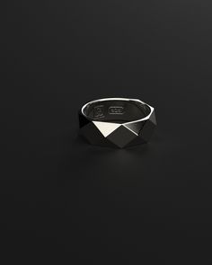 Great design work in a magic piece full of brilliant infinite shapes that make you enjoy his reflections thanks to a sterling silver masterfully polished by the best artisans. Available in silver, gold and black gold. Minimalist style and based on polygonal geometric surfaces, it is sleek and fresh, perfect for any casual or more serious outfit, so it fits wonderfully on any occasion Made entirely by hand with all the love and art of the best silver artisans. Metal: 925 Solid Sterling Silver / 24k Gold Plated / Rhodium over 925 Sterling Silver Dimensions: 7.5 mm W x 24.5 mm L Weight: 9.6 grams 100% Handcrafted Package: High quality velvet pouches Serious Outfit, Modern Minimalism, Style Minimaliste, Black Rhodium, Outfit Casual, Black Rings, Minimalist Style, Minimalist Fashion, Silver Gold