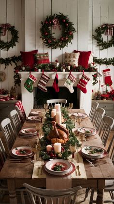 a dining room table set for christmas dinner